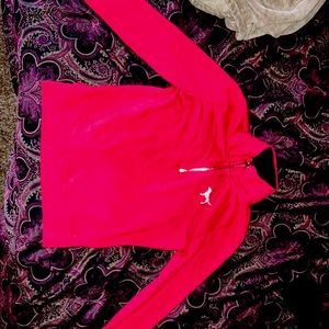 A pull over pink sweater